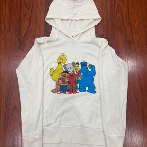 KAWS x Uniqlo Cream Hoodie with Colorful Design